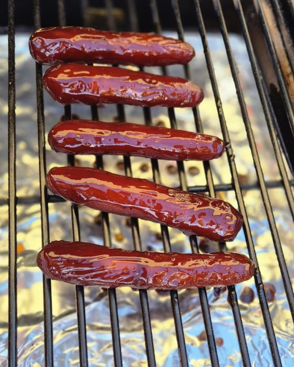 Glazed carrots in the smoker for the signature carrot hot dog